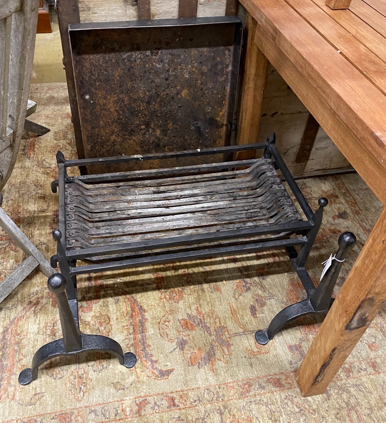 A wrought iron fire basket with dogs and ash pan, basket width 65cm, depth 35cm